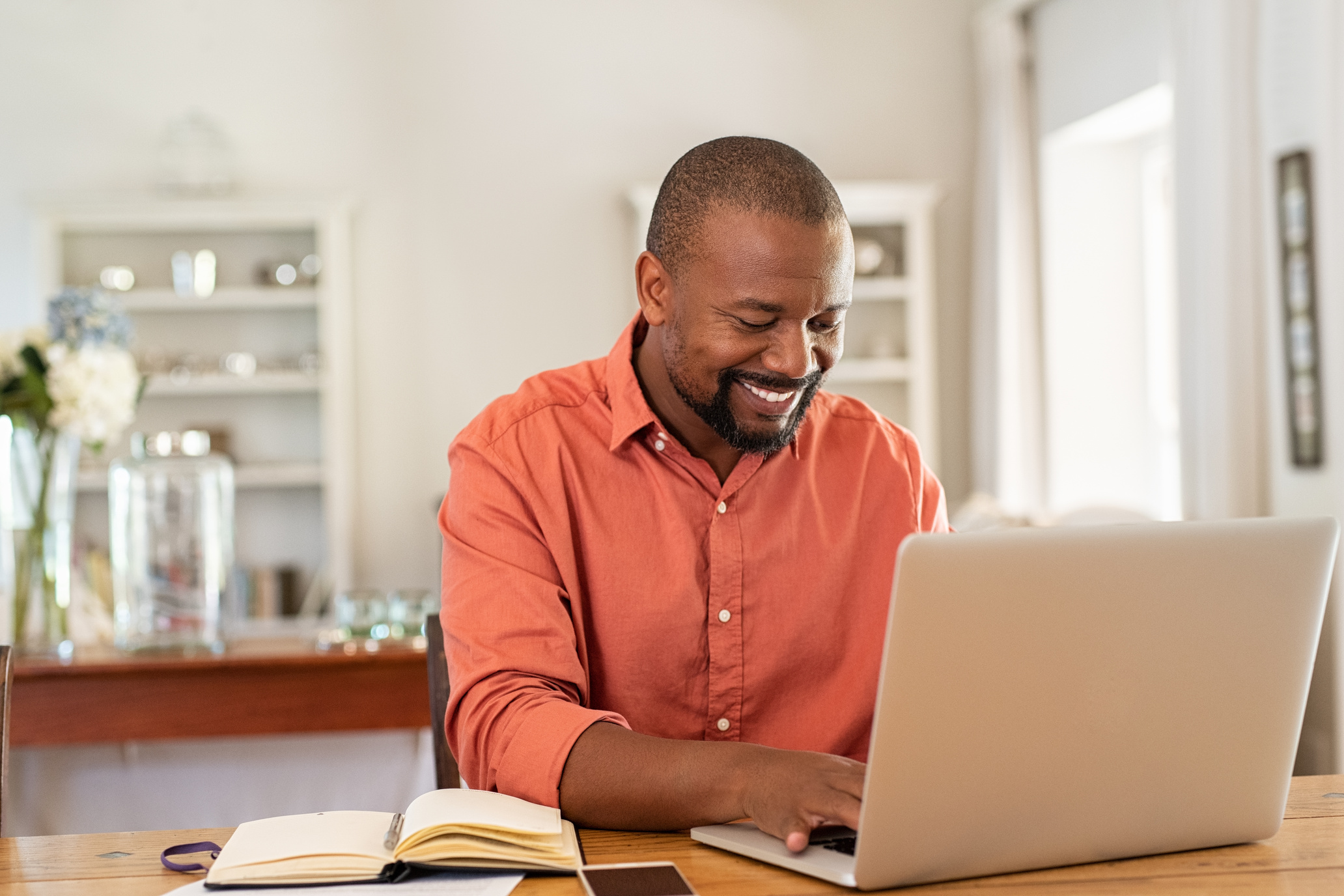 Happy Man Using Laptop